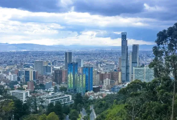 Skyline of Bogotá, Colombia, highlighting StoneX Payments' new cross-border payment services.